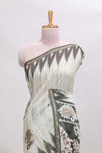 Green tribal dance dance motifs linen cotton saree with contrast ikkat border and printed pallu