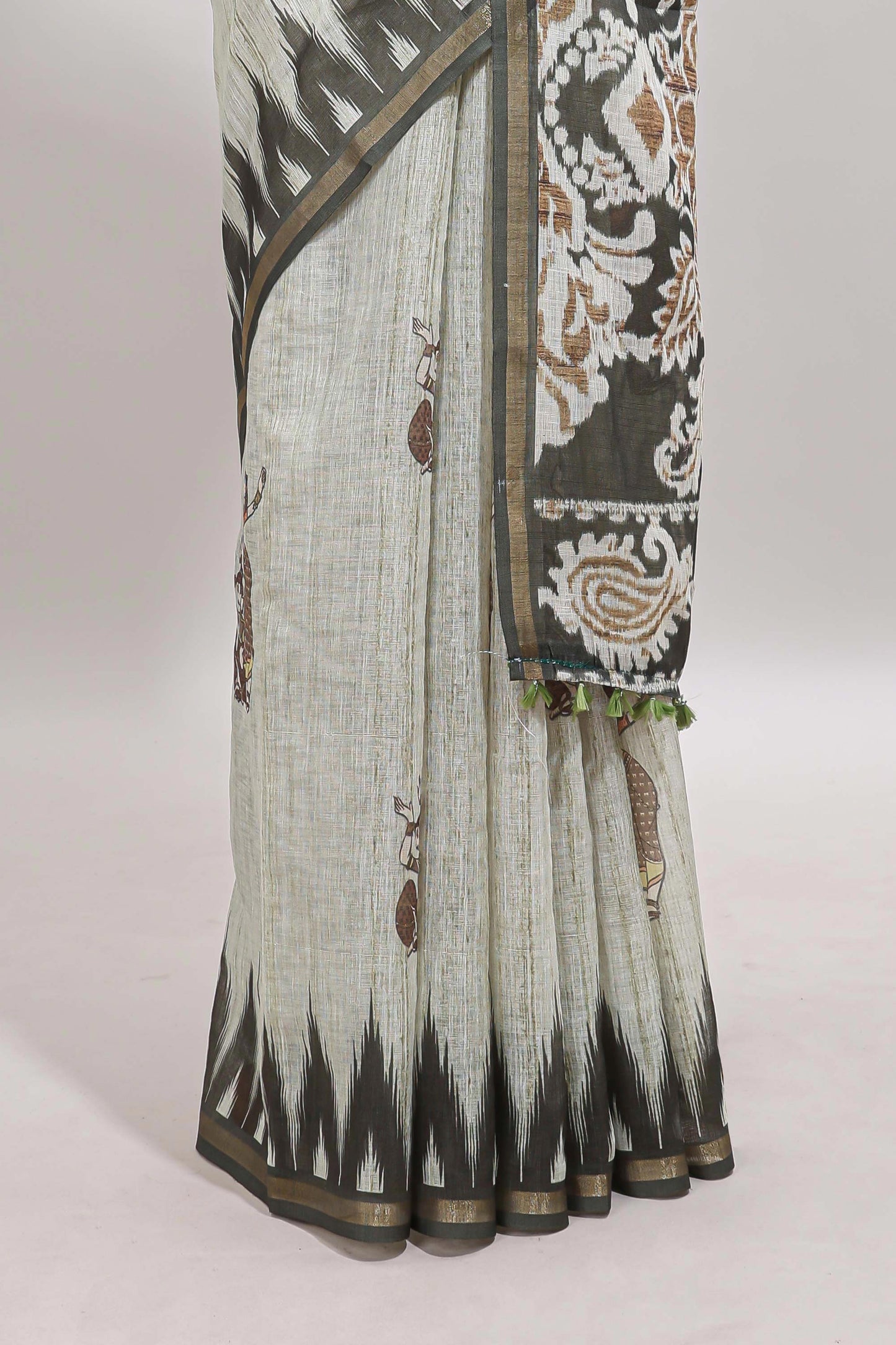 Green tribal dance dance motifs linen cotton saree with contrast ikkat border and printed pallu