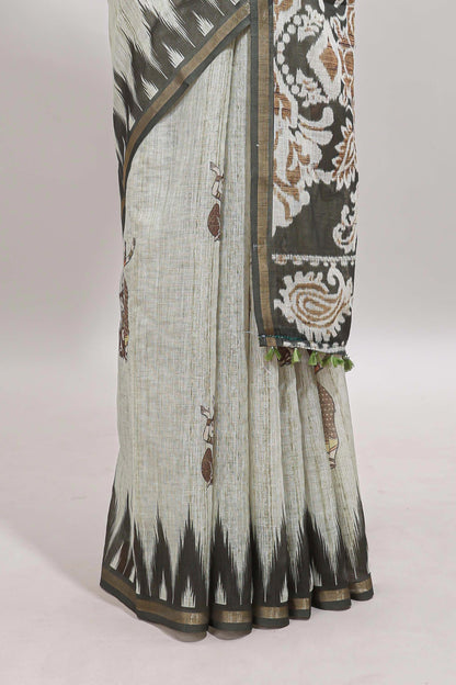 Green tribal dance dance motifs linen cotton saree with contrast ikkat border and printed pallu