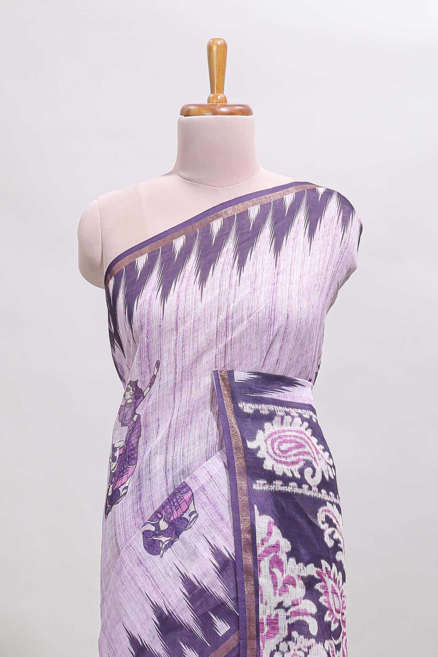 Purple tribal dance dance motifs linen cotton saree with contrast ikkat border and printed pallu