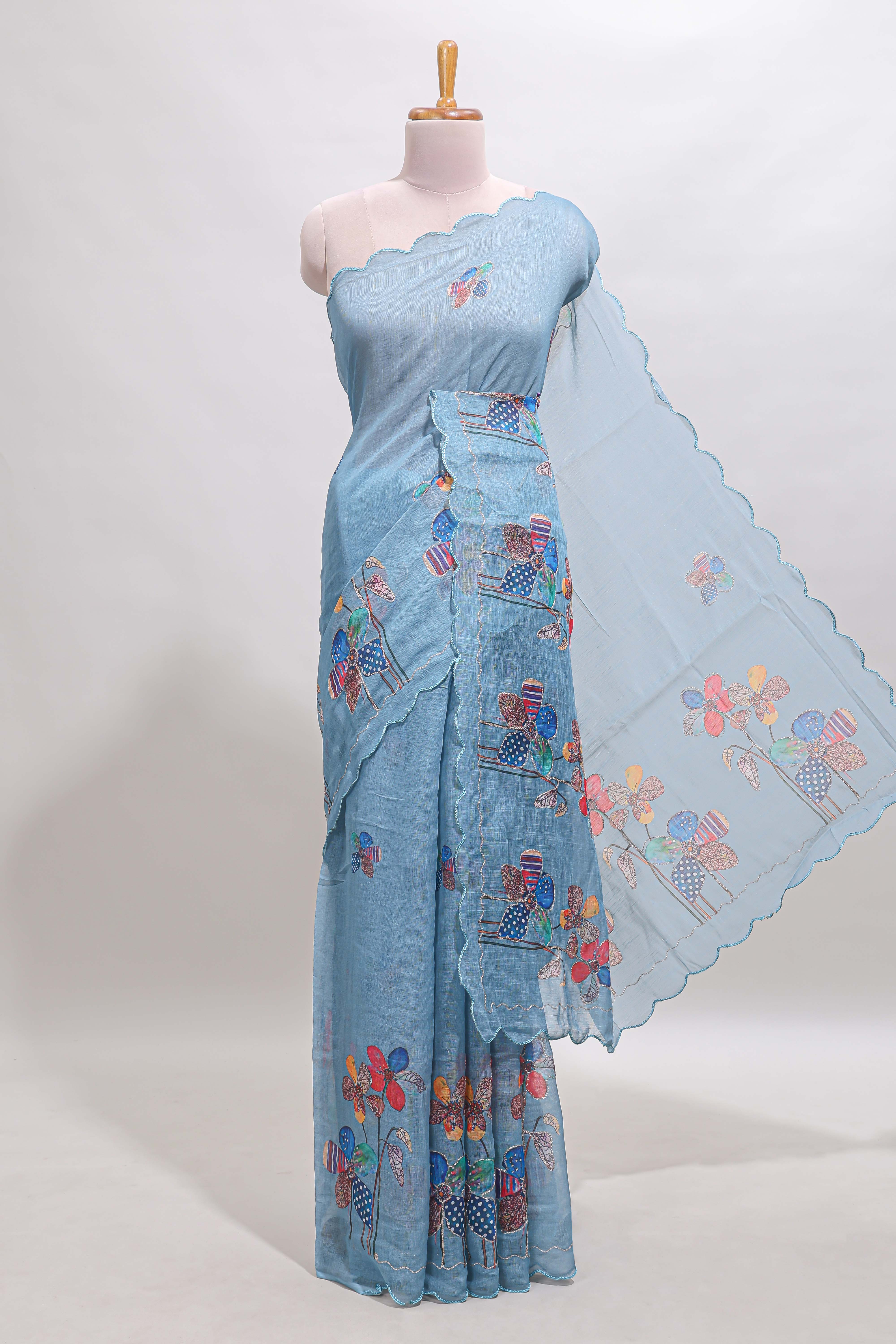 Blue floral design linen cotton saree with scallop border and matching printed blouse