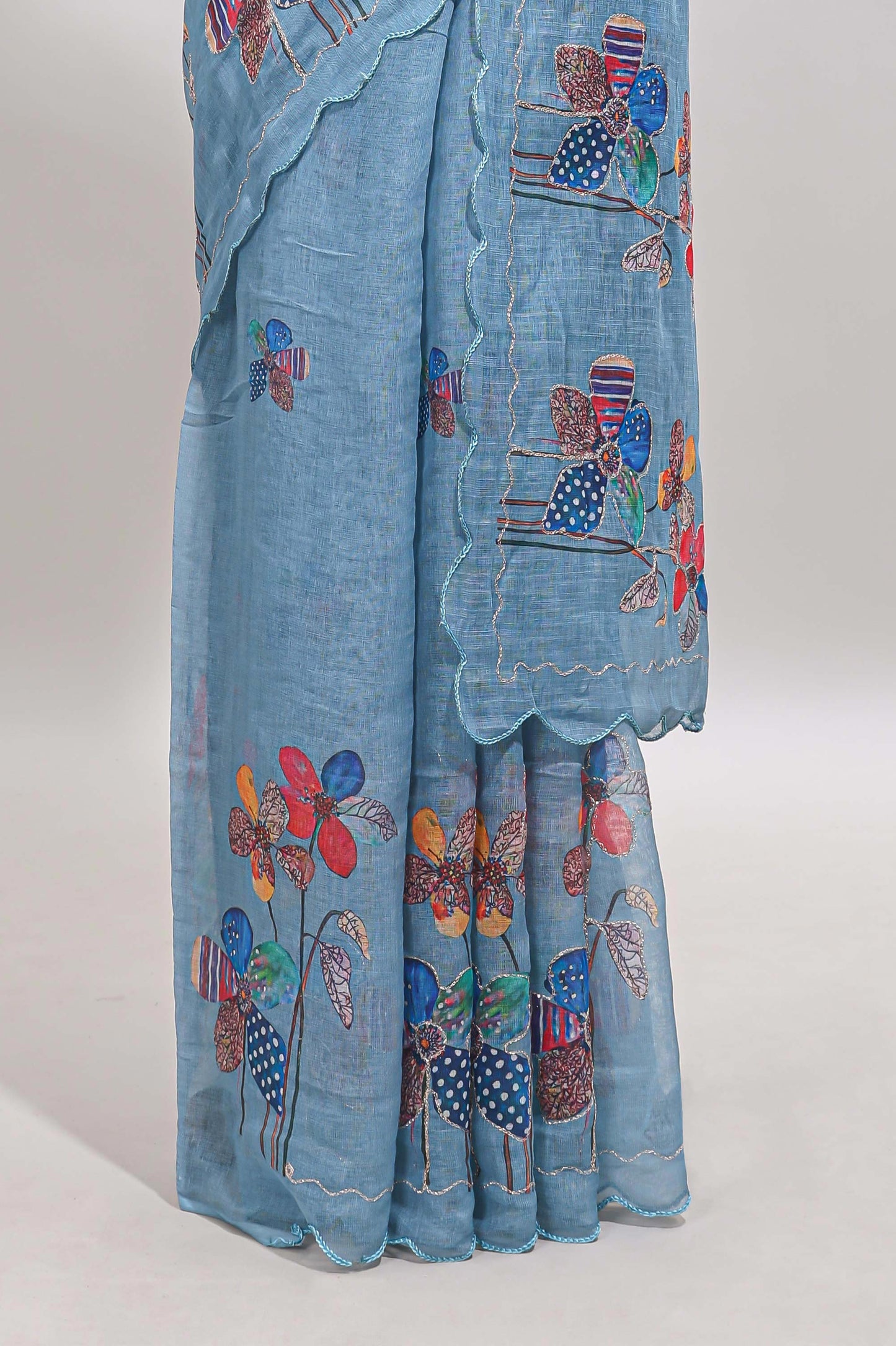 Blue floral design linen cotton saree with scallop border and matching printed blouse