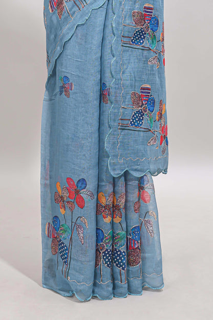 Blue floral design linen cotton saree with scallop border and matching printed blouse