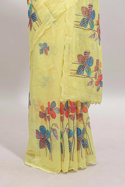 Yellow floral design linen cotton saree with scallop border and matching printed blouse
