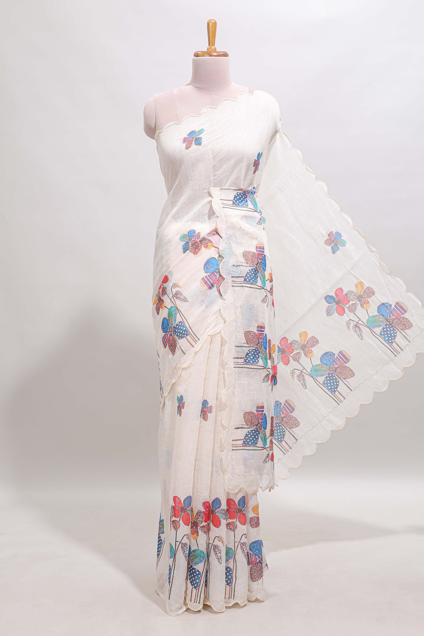 Off white floral design linen cotton saree with scallop border and matching printed blouse