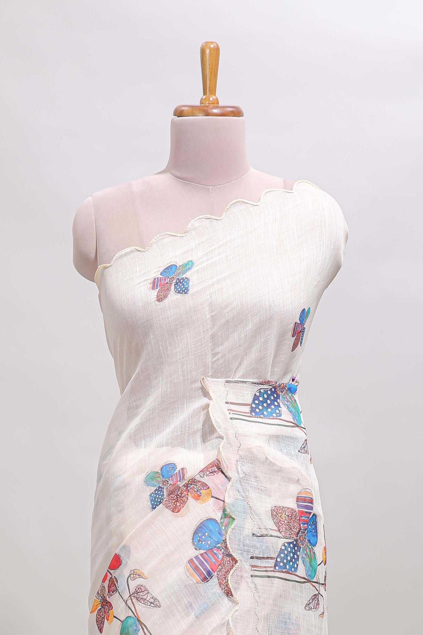 Off white floral design linen cotton saree with scallop border and matching printed blouse