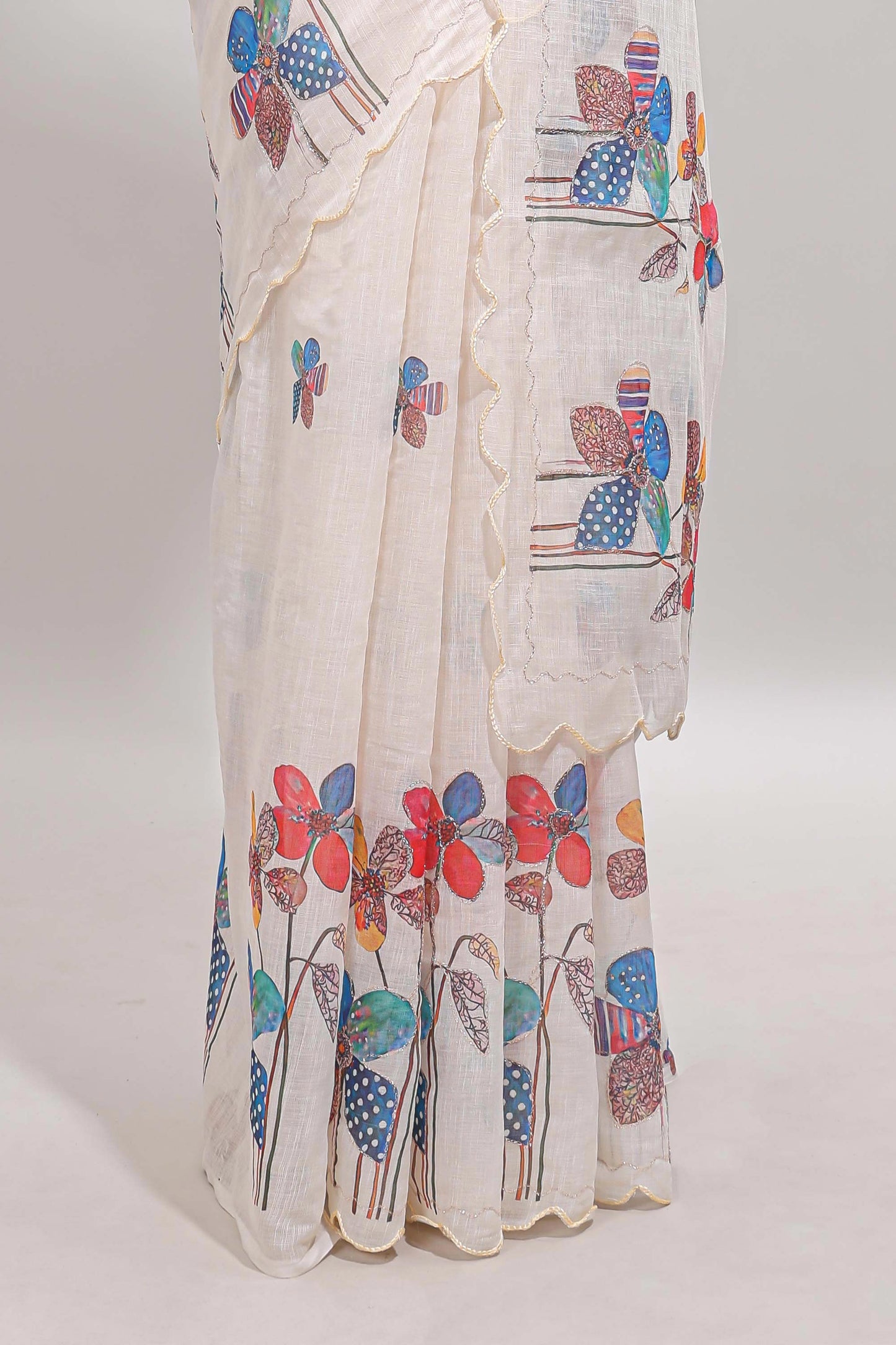 Off white floral design linen cotton saree with scallop border and matching printed blouse