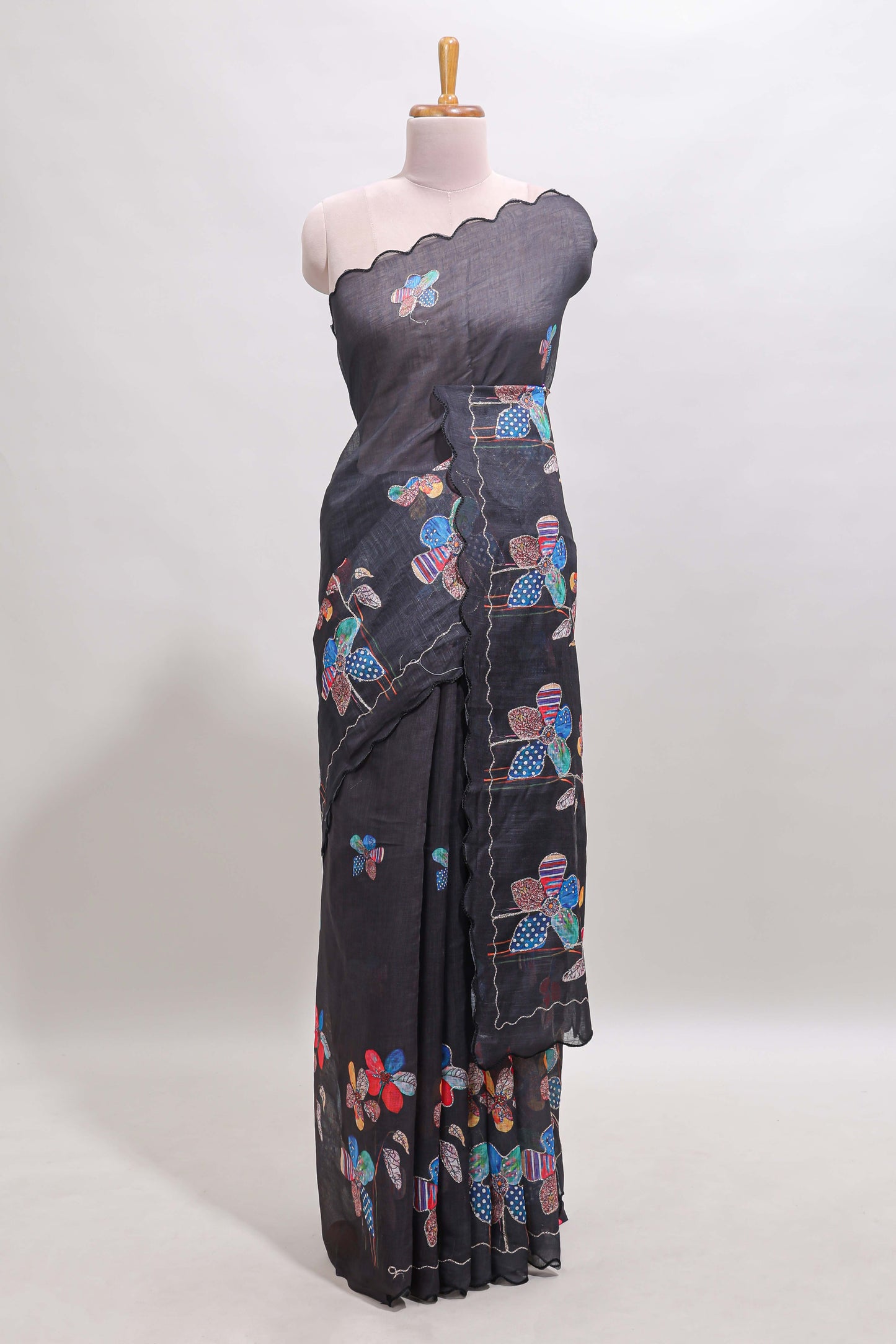 Black floral design linen cotton saree with scallop border and matching printed blouse