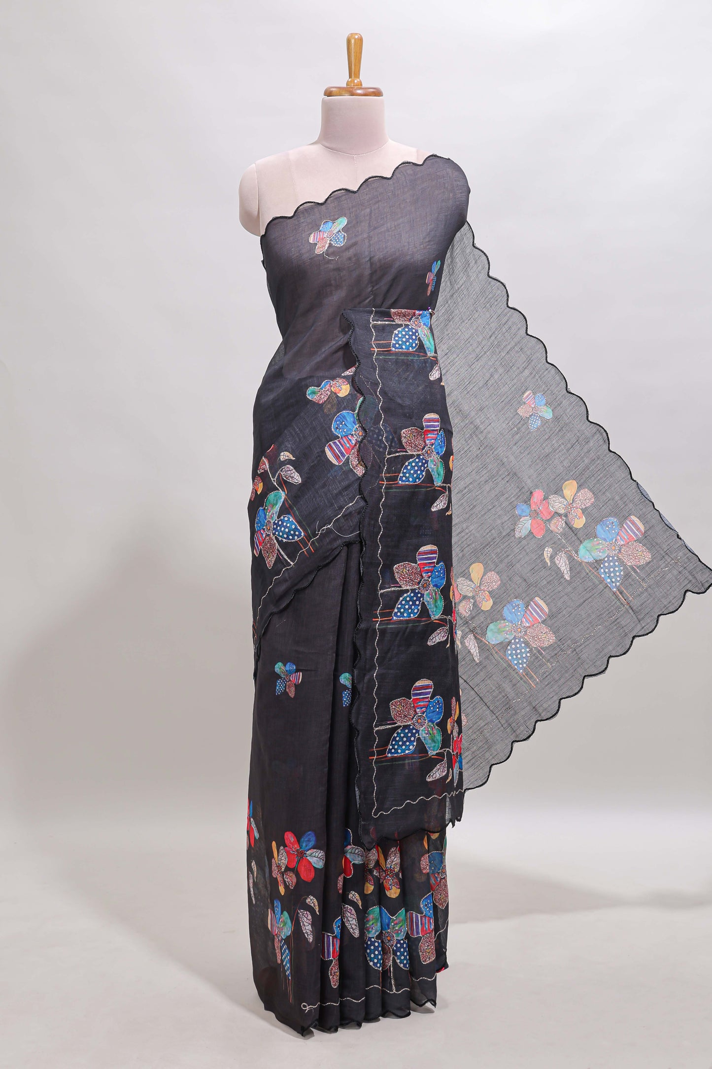 Black floral design linen cotton saree with scallop border and matching printed blouse