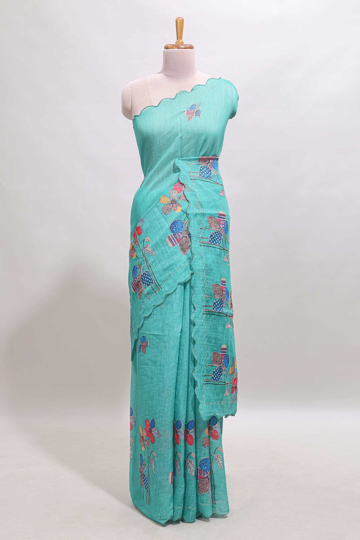 Green floral design linen cotton saree with scallop border and matching printed blouse