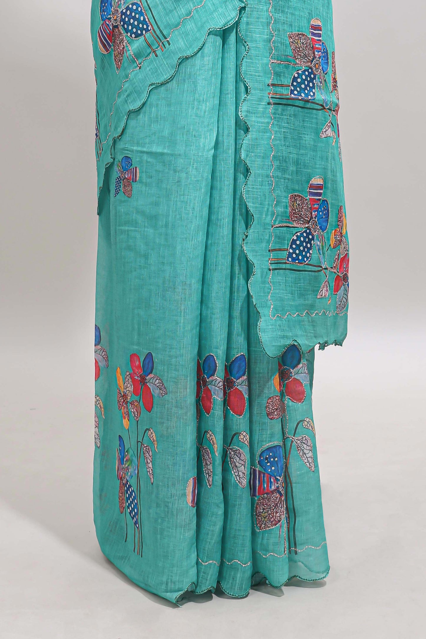 Green floral design linen cotton saree with scallop border and matching printed blouse