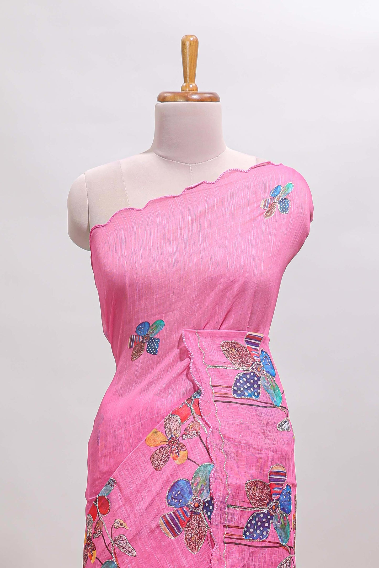 Pink floral design linen cotton saree with scallop border and matching printed blouse