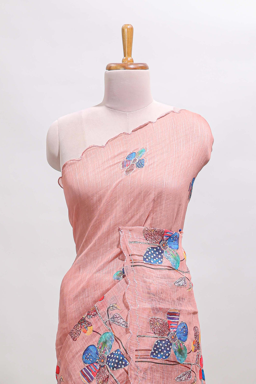 Peach floral design linen cotton saree with scallop border and matching printed blouse