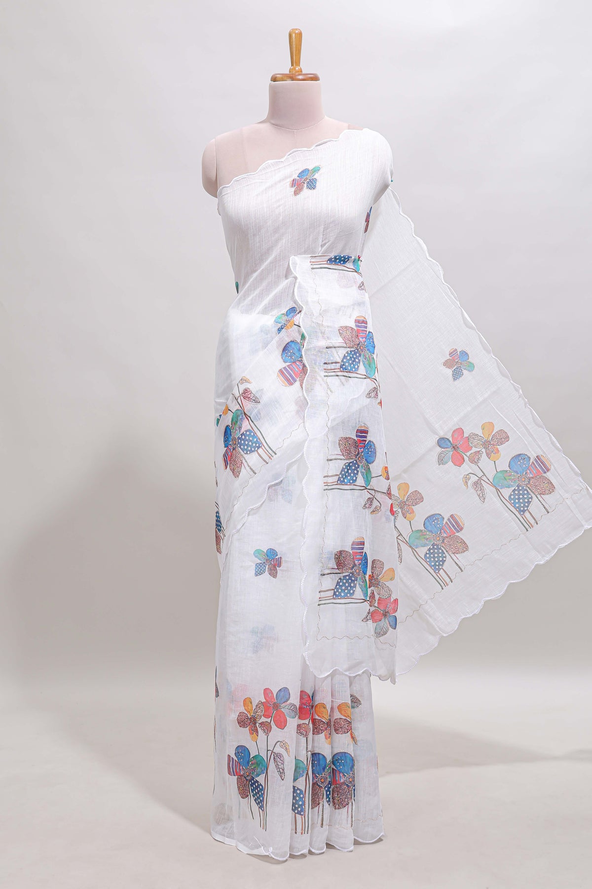 White floral design linen cotton saree with scallop border and matching printed blouse
