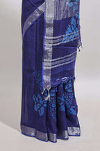 Blue floral design linen cotton saree with self zari border and matching plain blouse