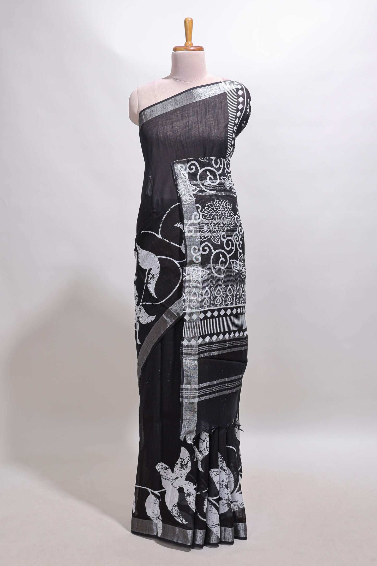 Black floral design linen cotton saree with self zari border and matching plain blouse