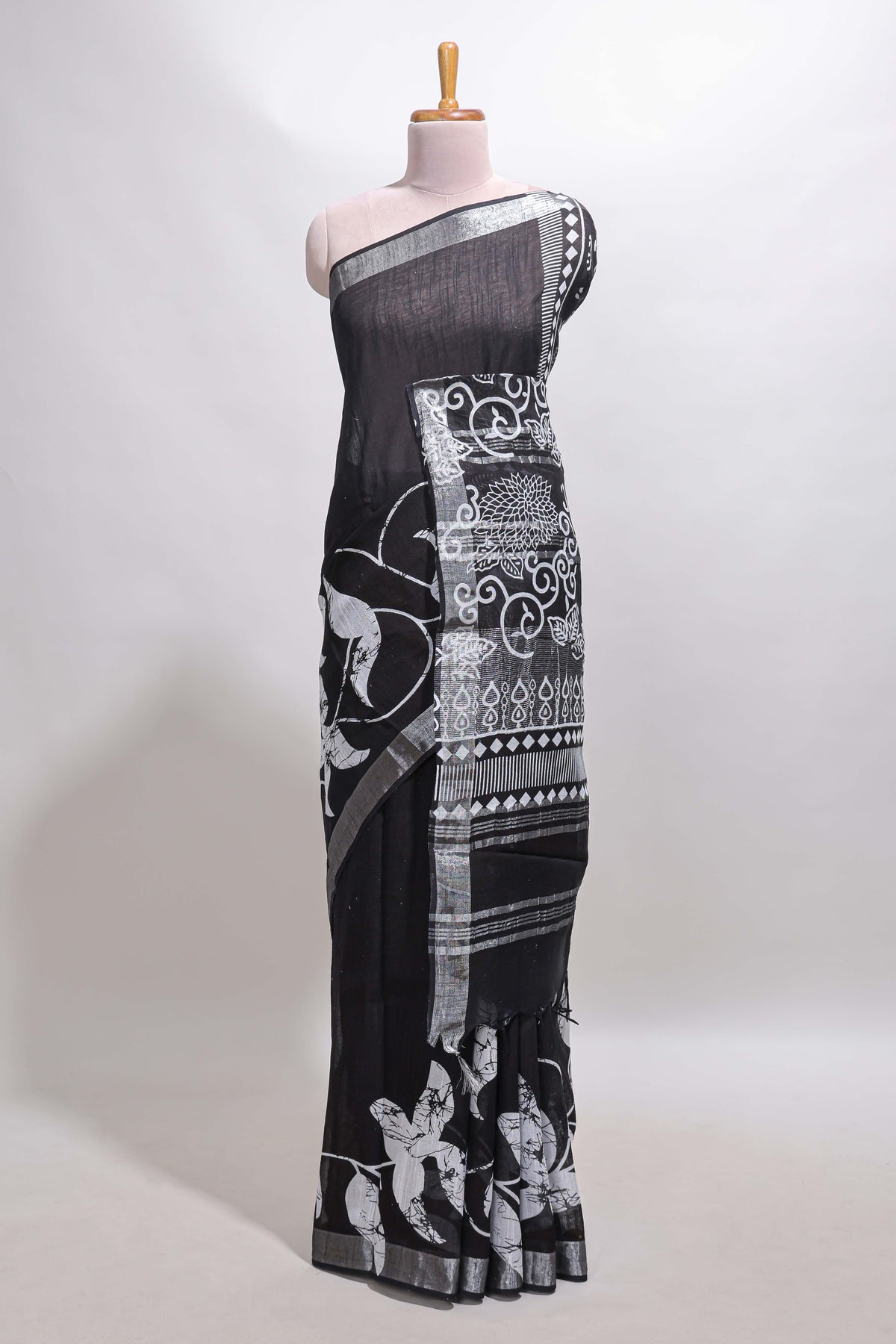 Black floral design linen cotton saree with self zari border and matching plain blouse