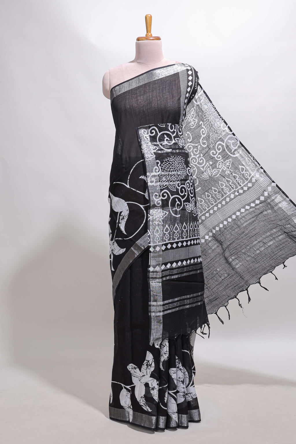 Black floral design linen cotton saree with self zari border and matching plain blouse
