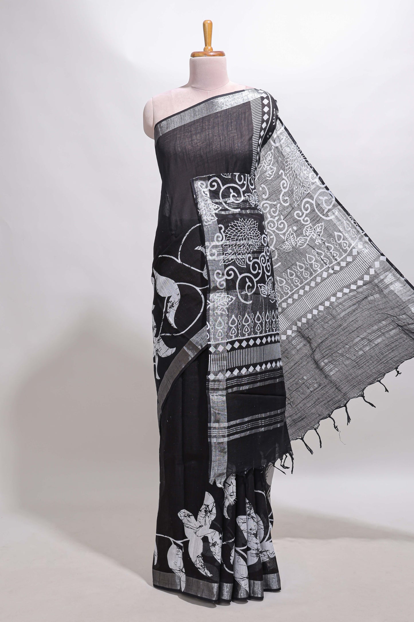 Black floral design linen cotton saree with self zari border and matching plain blouse