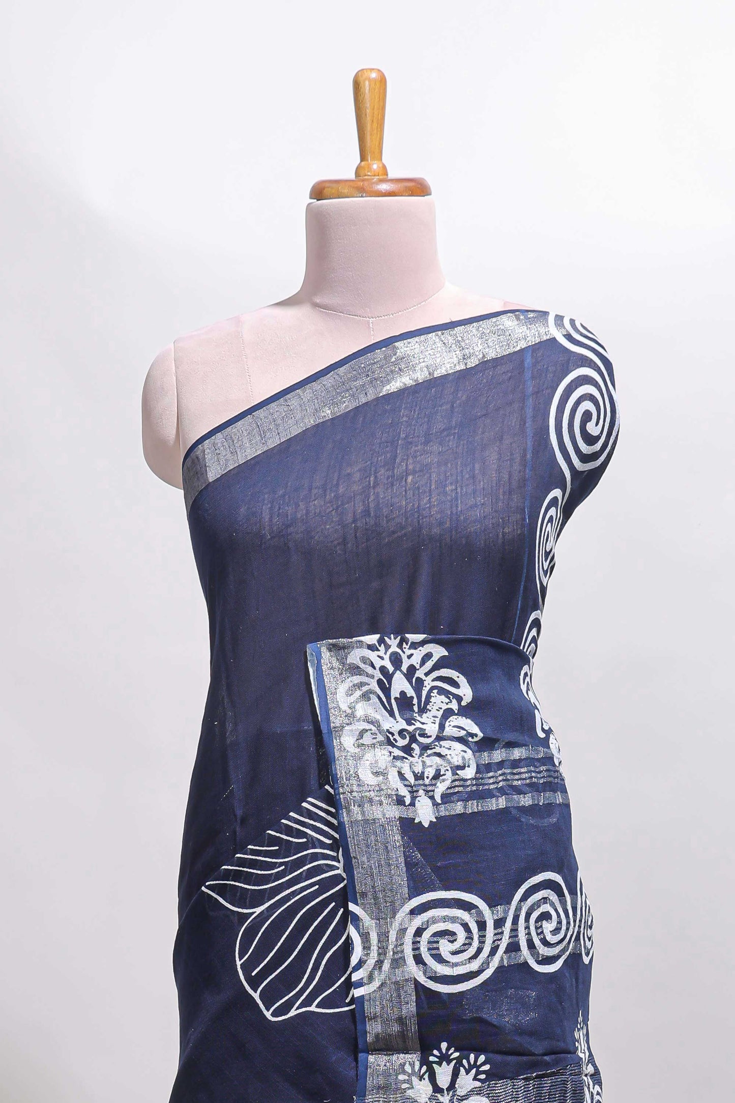 Dark blue floral design linen cotton saree with self zari border and matching plain blouse
