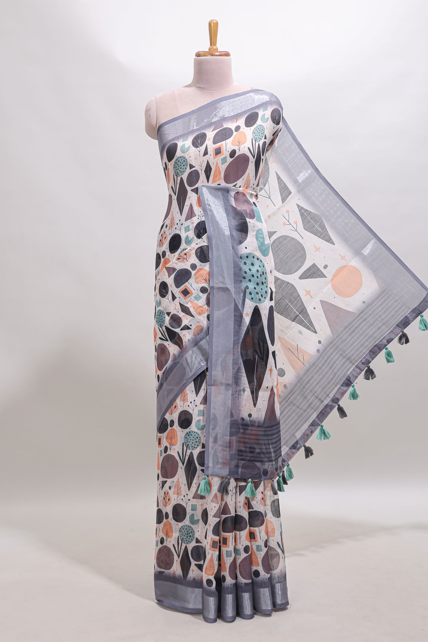 Beige geometric design linen cotton saree with contrast zari border and matching blouse