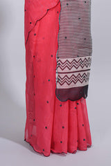 Coral pink linen cotton saree withsequin details striped and geometric zigzag pallu with scallop border along with striped blouse