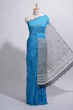 Blue linen cotton saree with  sequin details striped and geometric zigzag pallu with scallop border along with striped blouse