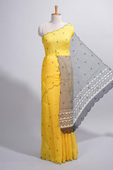 Yellow linen cotton saree withsequin details striped and geometric zigzag pallu with scallop border along with striped blouse