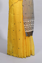 Yellow linen cotton saree with  sequin details striped and geometric zigzag pallu with scallop border along with striped blouse