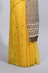 Yellow linen cotton saree withsequin details striped and geometric zigzag pallu with scallop border along with striped blouse