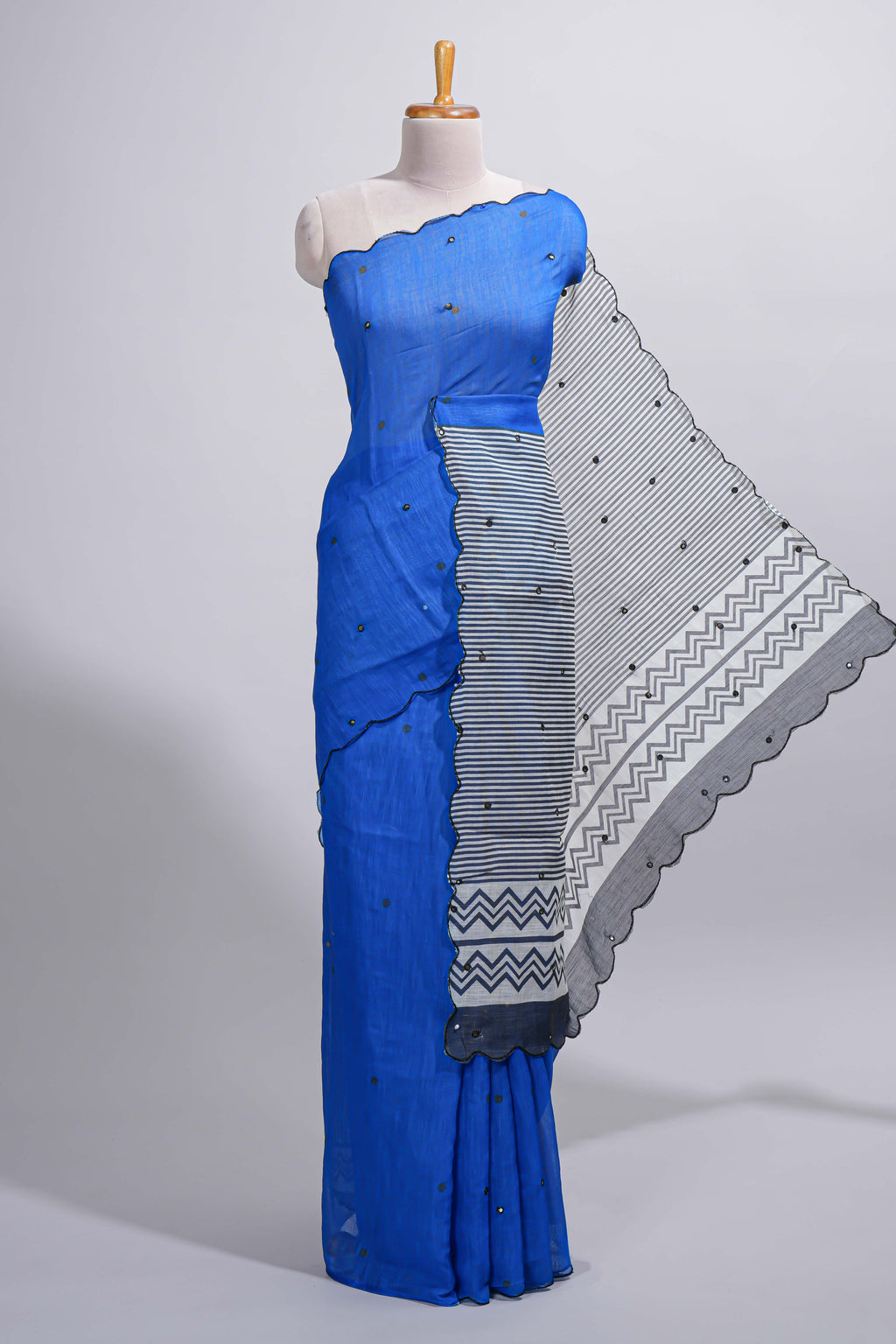 Royal blue linen cotton saree with  sequin details striped and geometric zigzag pallu with scallop border along with striped blouse
