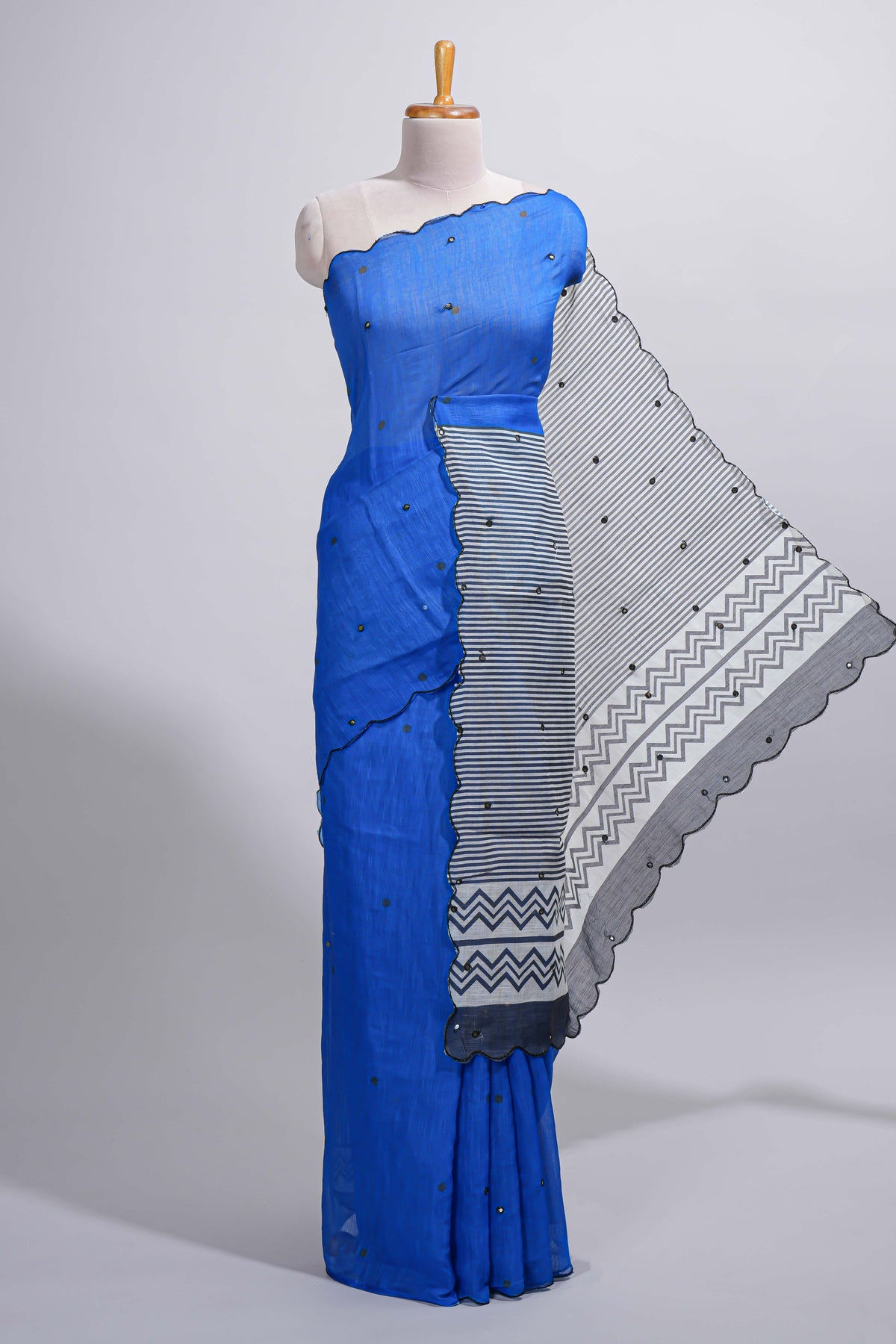 Royal blue linen cotton saree with  sequin details striped and geometric zigzag pallu with scallop border along with striped blouse