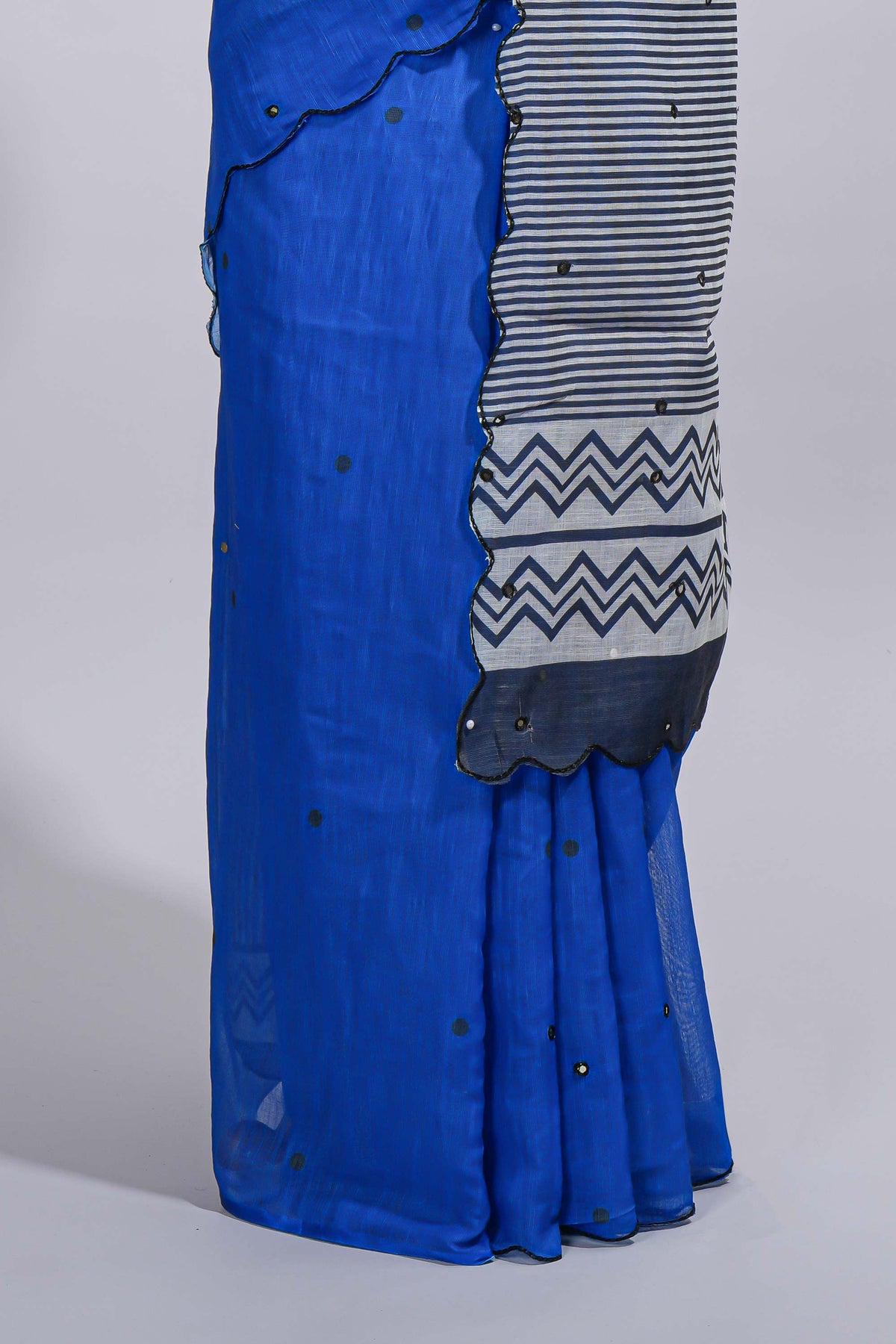 Royal blue linen cotton saree with  sequin details striped and geometric zigzag pallu with scallop border along with striped blouse