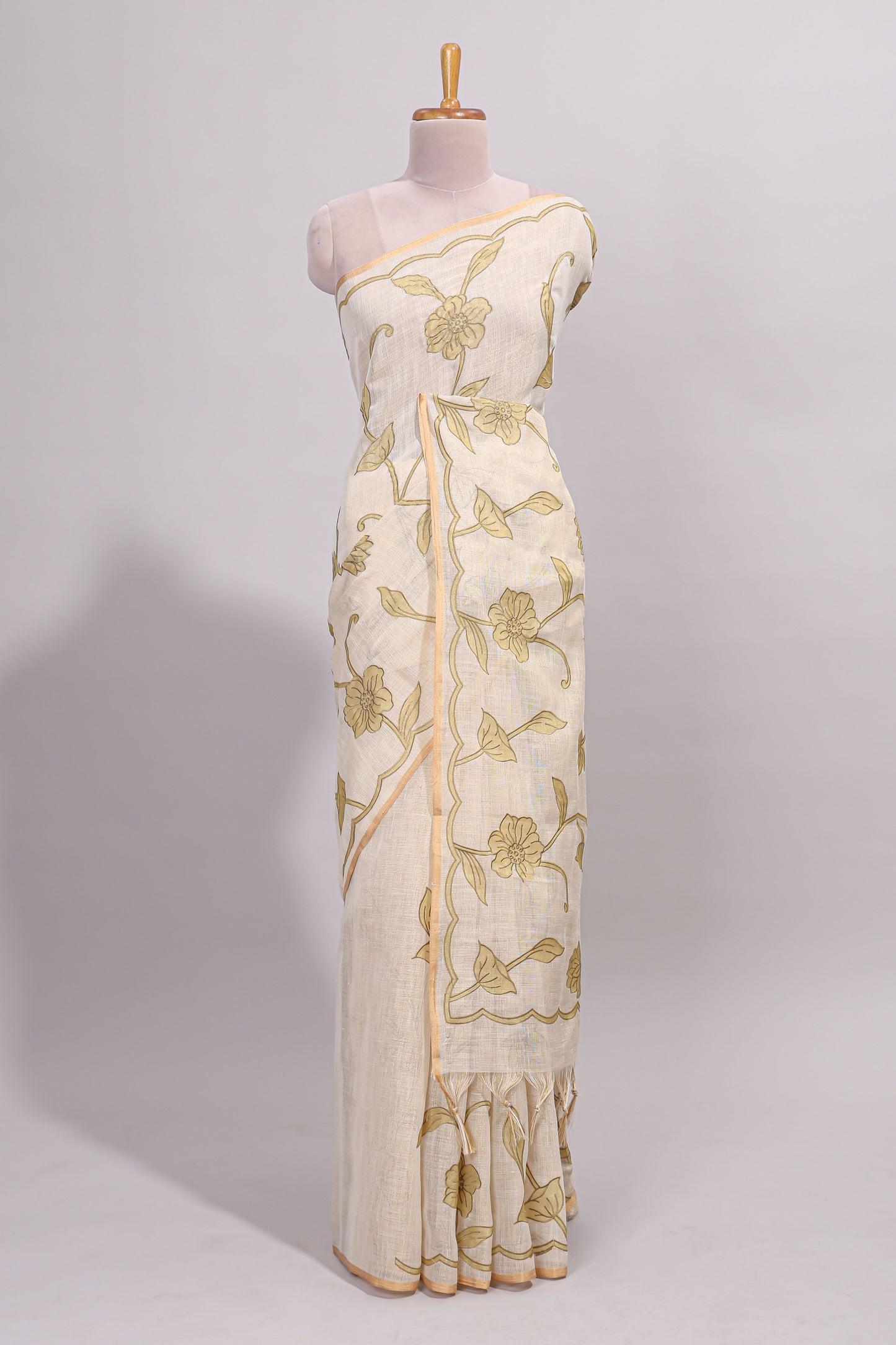 Cream floral design linen cotton saree with self zari border and matching printed blouse