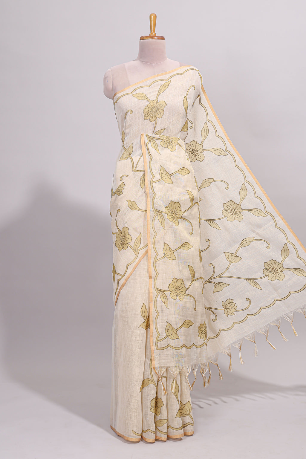 Cream floral design linen cotton saree with self zari border and matching printed blouse