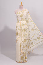 Cream floral design linen cotton saree with self zari border and matching printed blouse
