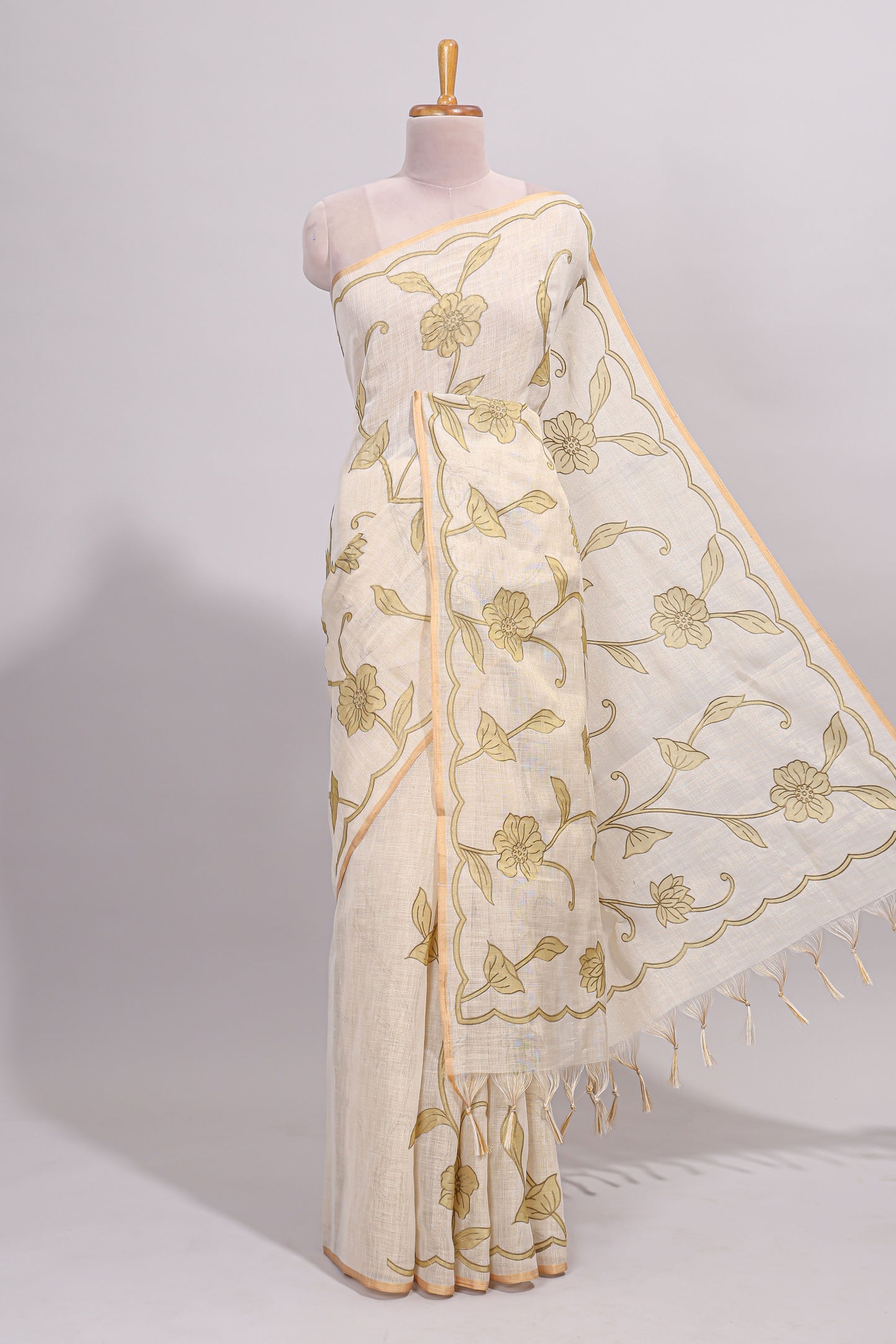Cream floral design linen cotton saree with self zari border and matching printed blouse