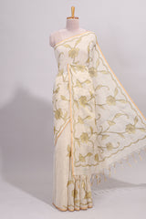 Cream floral design linen cotton saree with self zari border and matching printed blouse