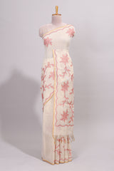 Cream floral design linen cotton saree with self zari border and contrast printed blouse