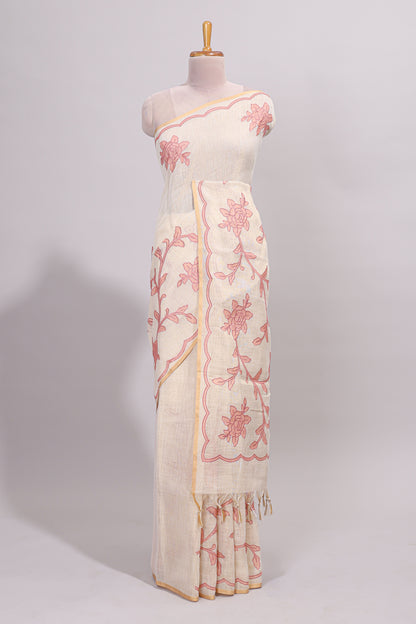 Cream floral design linen cotton saree with self zari border and contrast printed blouse
