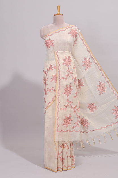Cream floral design linen cotton saree with self zari border and contrast printed blouse