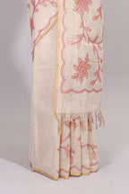 Cream floral design linen cotton saree with self zari border and contrast printed blouse