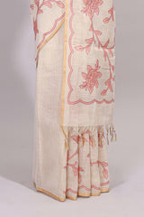 Cream floral design linen cotton saree with self zari border and contrast printed blouse