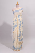 Cream floral design linen cotton saree with self zari border and matching printed blouse