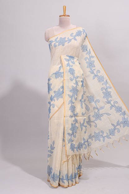 Cream floral design linen cotton saree with self zari border and matching printed blouse
