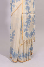 Cream floral design linen cotton saree with self zari border and matching printed blouse