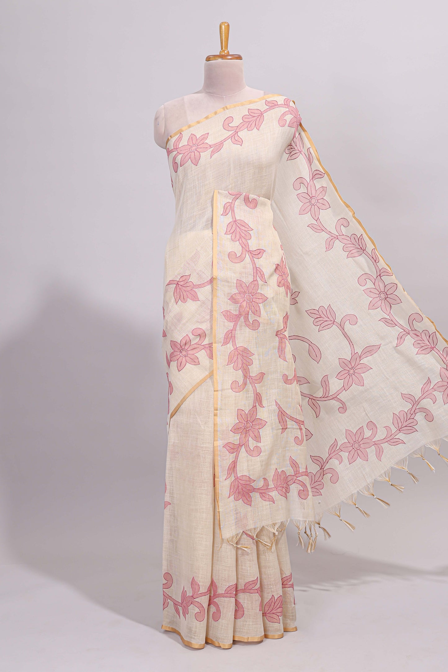 Cream floral design linen cotton saree with self zari border and matching printed blouse