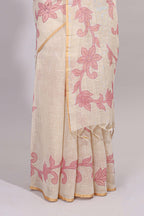 Cream floral design linen cotton saree with self zari border and matching printed blouse