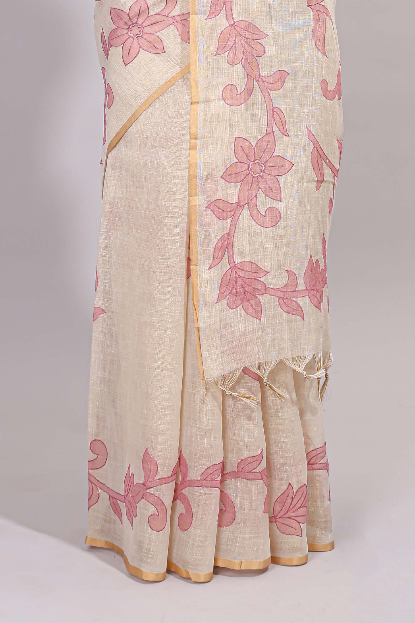 Cream floral design linen cotton saree with self zari border and matching printed blouse