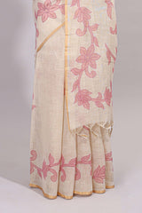 Cream floral design linen cotton saree with self zari border and matching printed blouse
